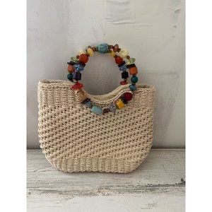 Capelli Straworld Inc. woman’s straw bag with faux stones handles